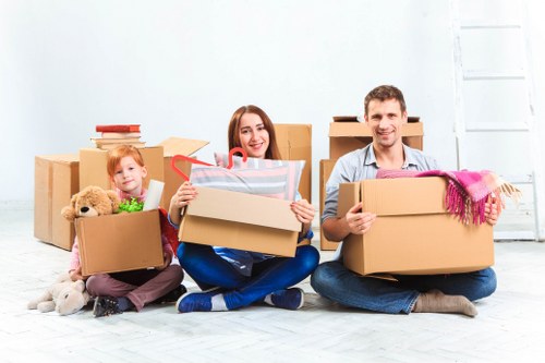 Professional movers handling boxes and furniture in Kingston