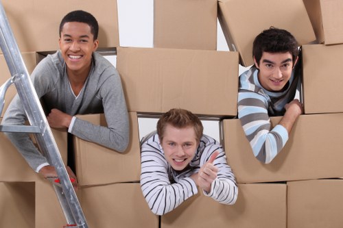 Loading furniture into a moving van during a man with van service