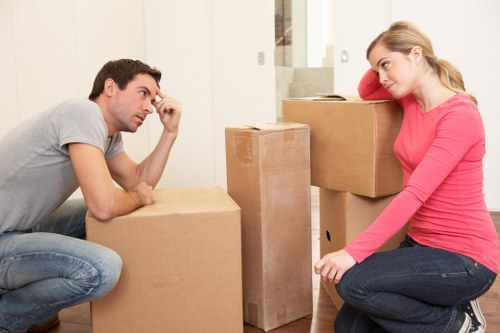 Packed moving boxes and furniture in a Kingston home
