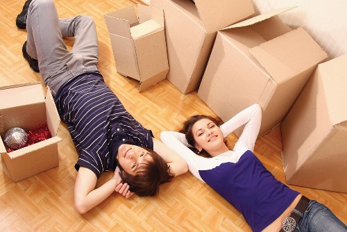 Packed moving boxes and furniture ready for transport in Kingston