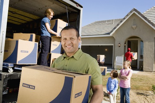 Movers handling household furniture with care during a local move