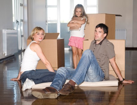 Removal team loading boxes and furniture for a local home move